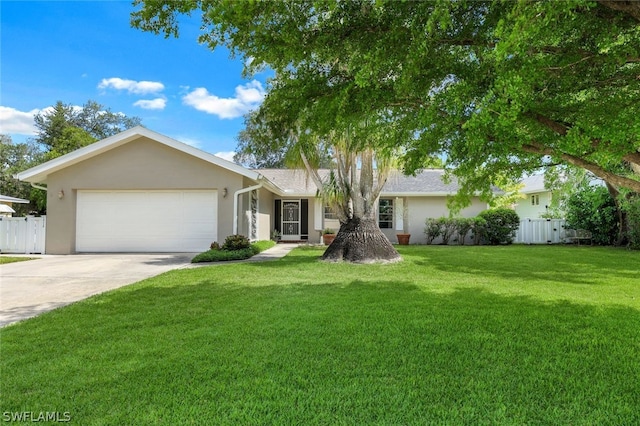 ranch-style home with a garage and a front lawn