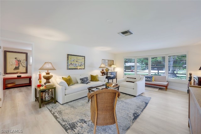 living room with light hardwood / wood-style flooring