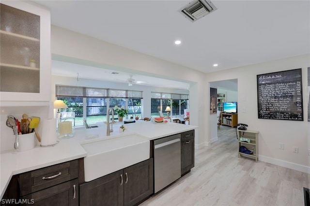 kitchen with ceiling fan, dishwasher, dark brown cabinetry, sink, and light wood-type flooring