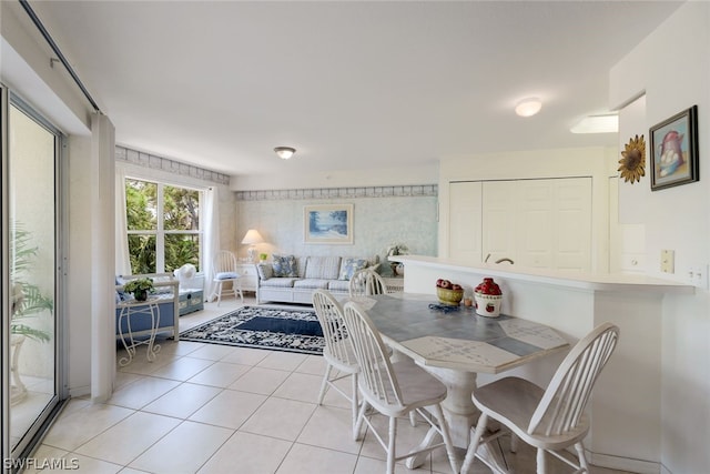 dining space with light tile floors