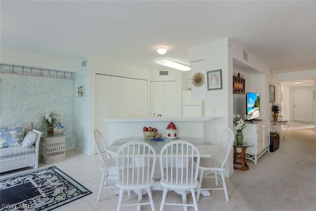 view of carpeted dining area