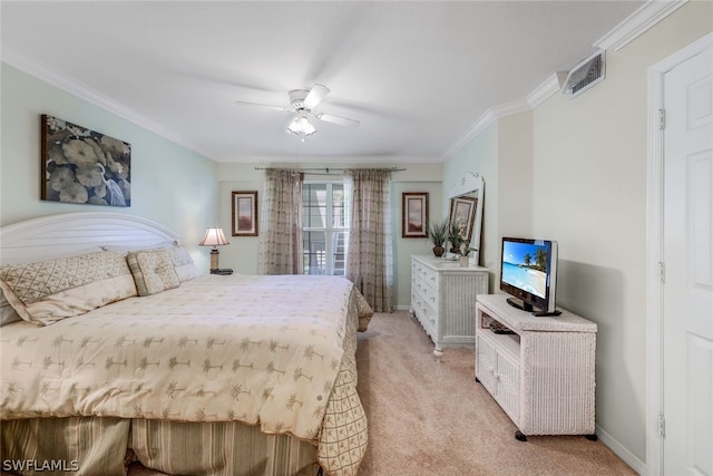 bedroom with light carpet, ceiling fan, and crown molding