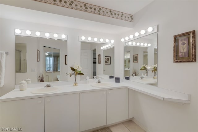 bathroom with tile flooring and dual vanity