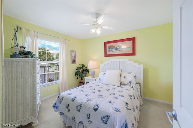 bedroom featuring ceiling fan and carpet