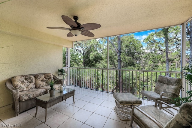 sunroom / solarium featuring ceiling fan