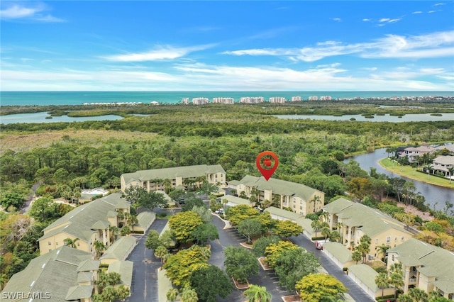 birds eye view of property featuring a water view