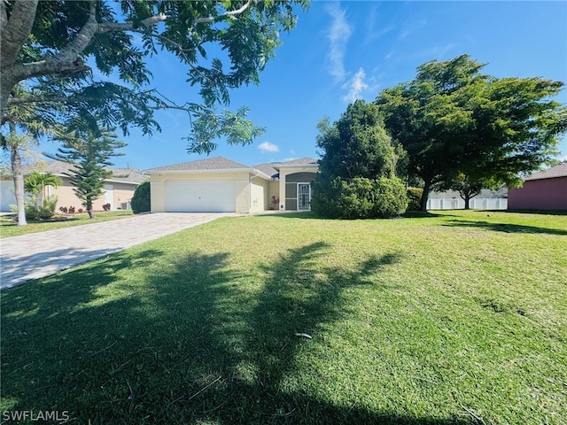 view of front facade with a garage and a front lawn