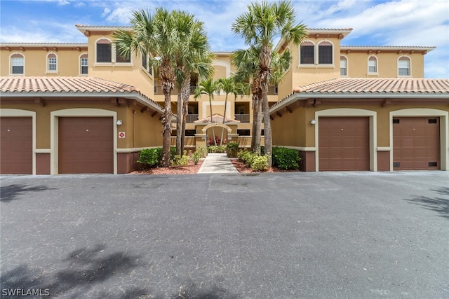 mediterranean / spanish house featuring a garage