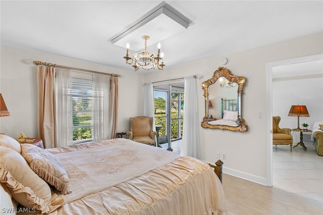 bedroom with light wood-type flooring, access to exterior, and an inviting chandelier