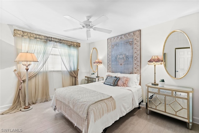 bedroom featuring wood-type flooring and ceiling fan