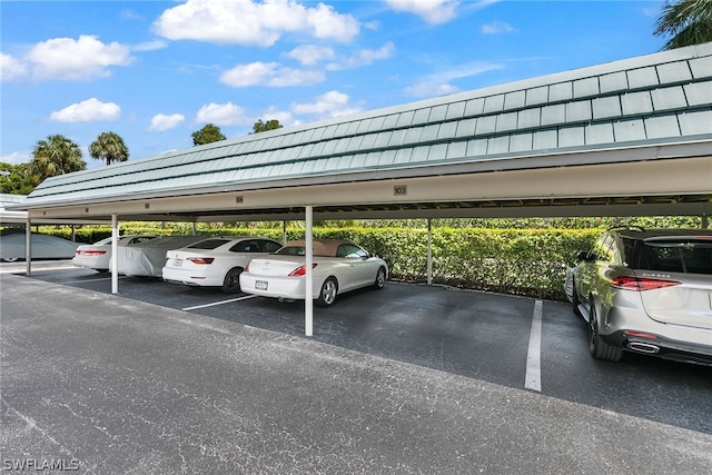 view of vehicle parking featuring a carport