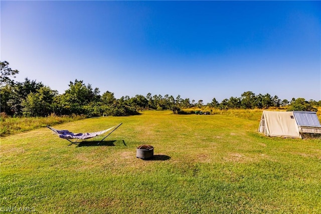 view of yard with a rural view