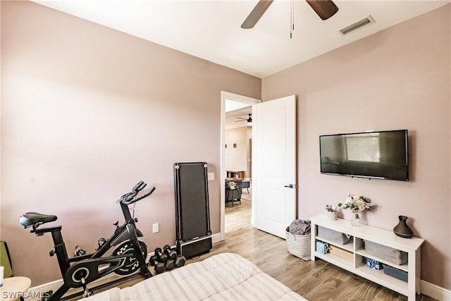 bedroom featuring ceiling fan and light hardwood / wood-style flooring