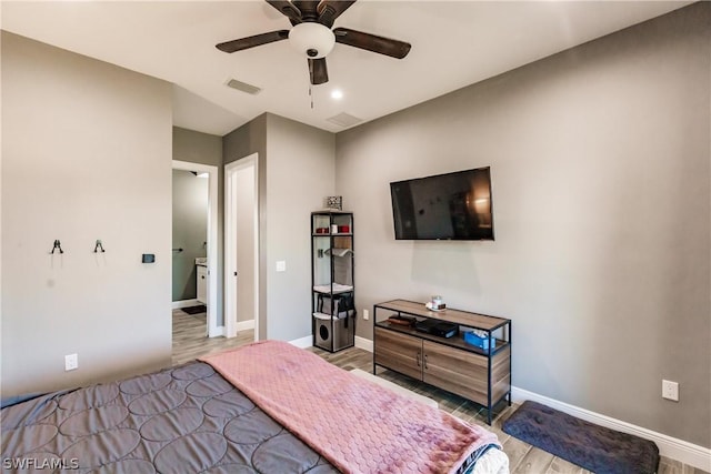 bedroom with light wood-type flooring and ceiling fan