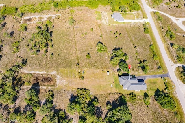 birds eye view of property featuring a rural view