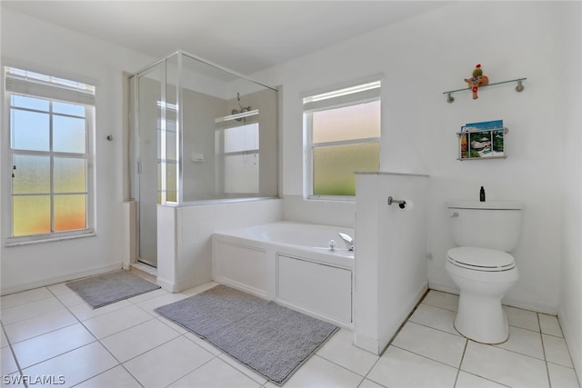 bathroom featuring separate shower and tub, tile patterned flooring, and toilet