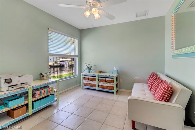 interior space featuring ceiling fan and light tile patterned floors