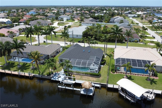 birds eye view of property featuring a residential view and a water view