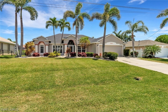 ranch-style home with a garage and a front yard