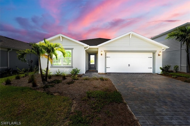 ranch-style house featuring a garage