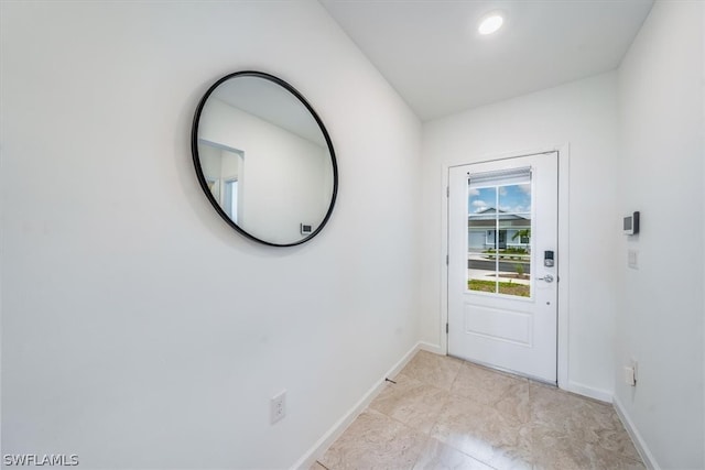 doorway with light tile floors