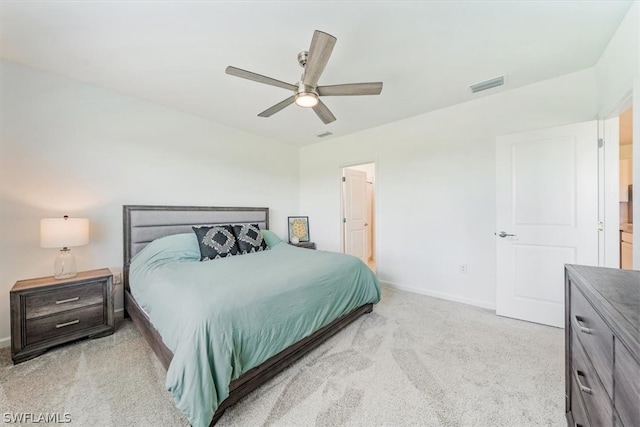 bedroom featuring light colored carpet and ceiling fan