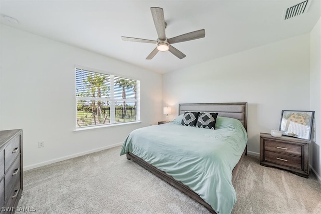 bedroom featuring light colored carpet and ceiling fan