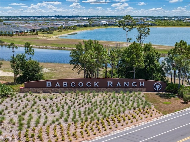 community sign with a water view