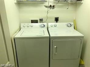 laundry room featuring washing machine and dryer, electric dryer hookup, and washer hookup