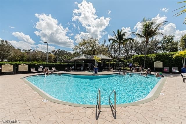 view of swimming pool featuring a patio area and a gazebo