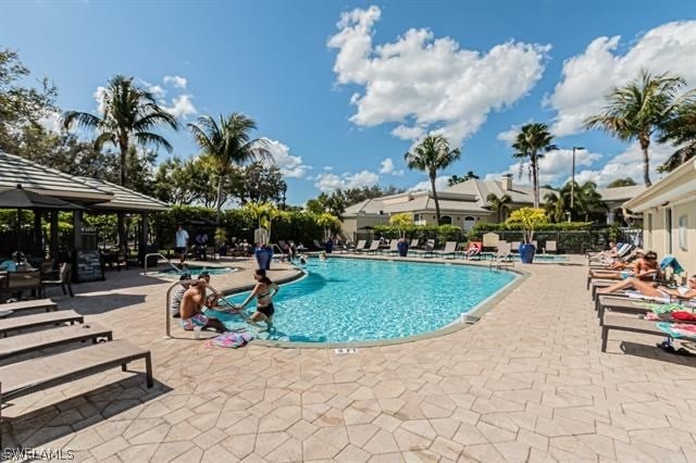 view of swimming pool with a gazebo and a patio area