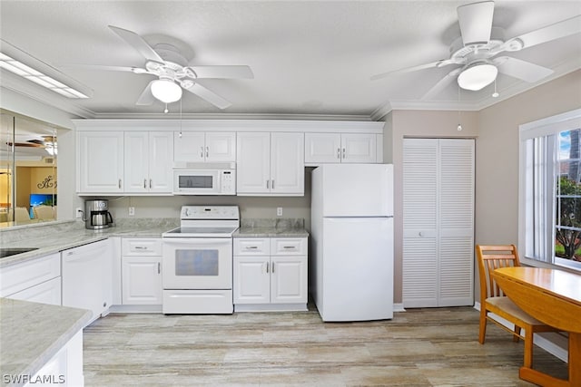 kitchen with white cabinets, white appliances, ceiling fan, and light hardwood / wood-style flooring