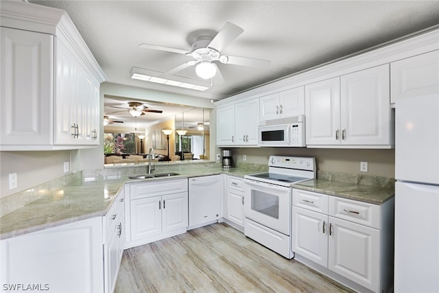 kitchen with light hardwood / wood-style flooring, white appliances, ceiling fan, white cabinetry, and sink