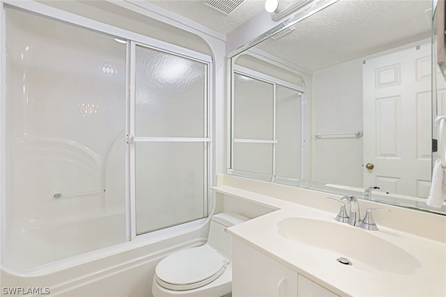 full bathroom with enclosed tub / shower combo, vanity, toilet, and a textured ceiling