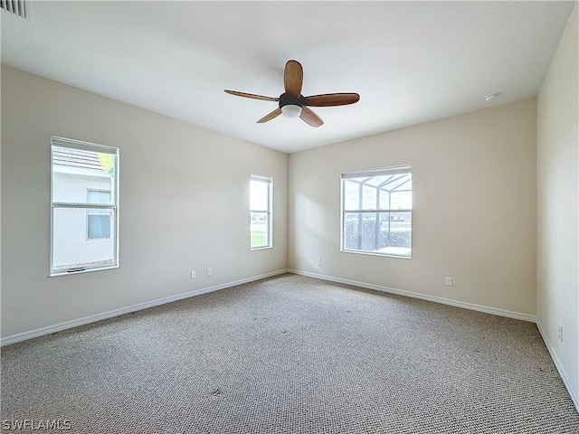 empty room with carpet floors and ceiling fan