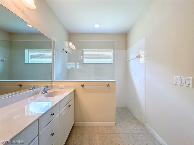 bathroom featuring oversized vanity and tile flooring