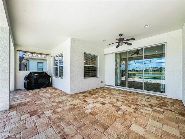 view of patio featuring ceiling fan and grilling area