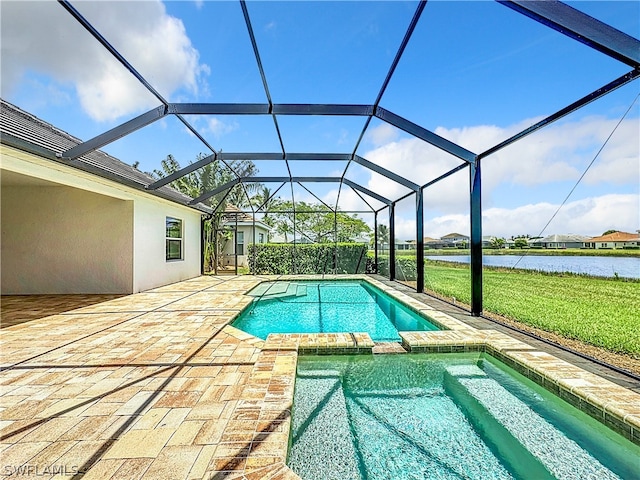 view of pool featuring a patio, a yard, a water view, and glass enclosure