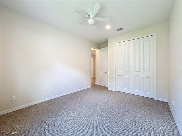 unfurnished bedroom featuring carpet flooring, a closet, and ceiling fan