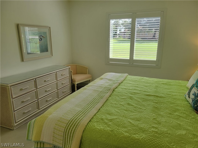 bedroom featuring light colored carpet