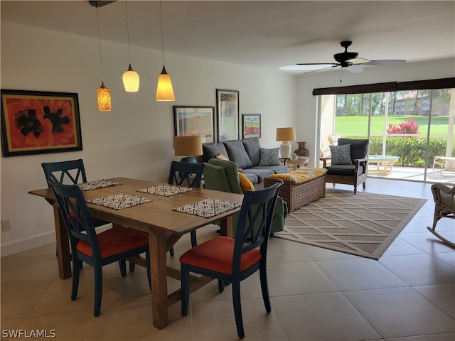 dining area with light tile patterned floors and ceiling fan