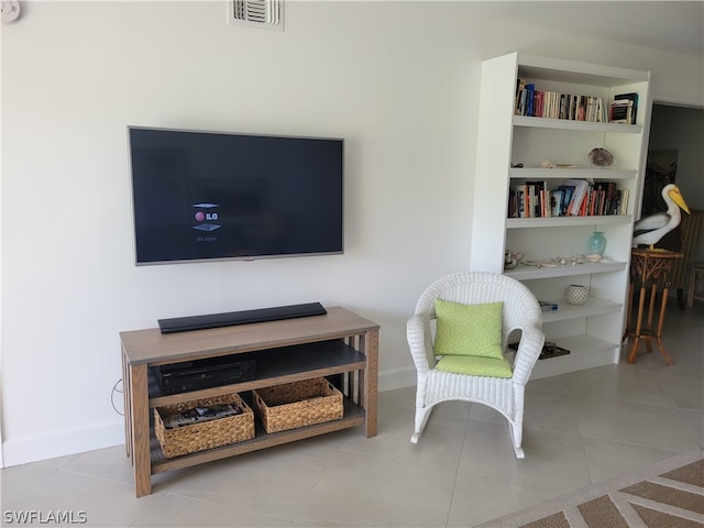 living area featuring light tile patterned flooring