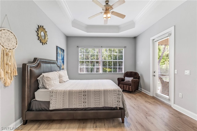 bedroom with access to outside, light wood-type flooring, multiple windows, and ceiling fan