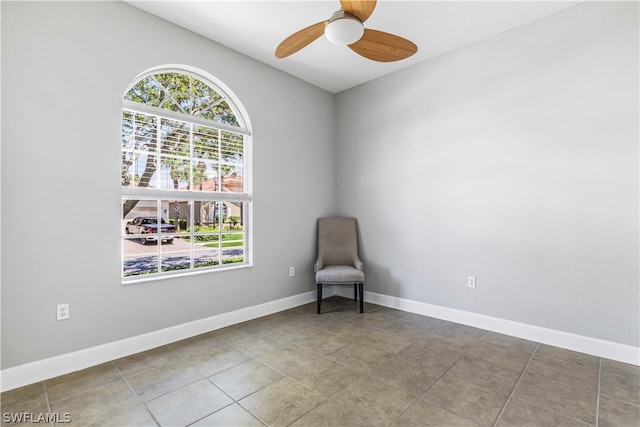 unfurnished room with ceiling fan and tile patterned floors