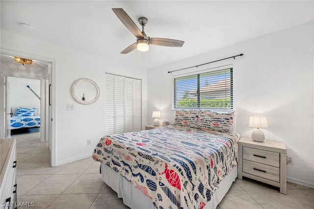 tiled bedroom featuring a closet and ceiling fan