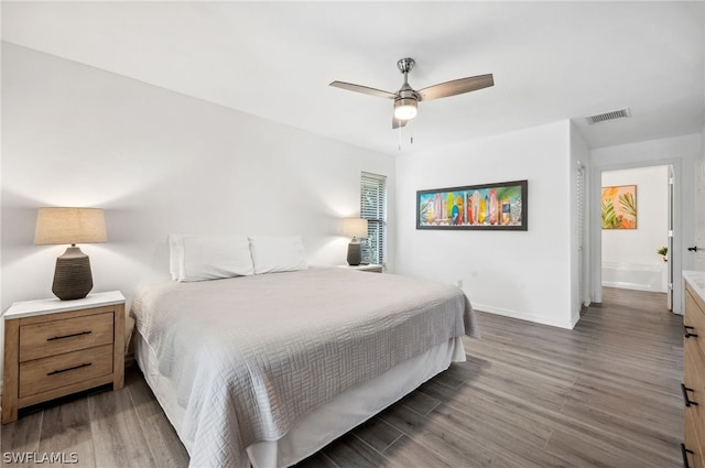 bedroom with ceiling fan and hardwood / wood-style floors