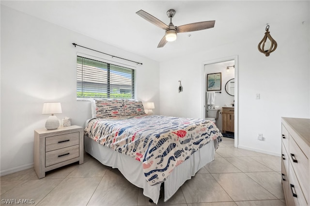 bedroom featuring ceiling fan, ensuite bathroom, and light tile floors