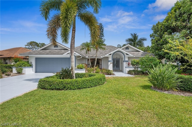 view of front of home featuring a garage and a front yard