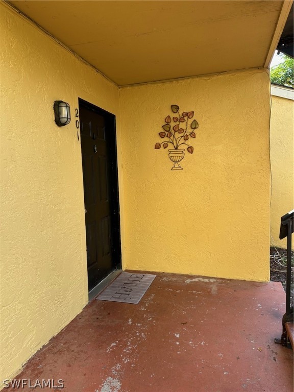 doorway to property featuring a patio area