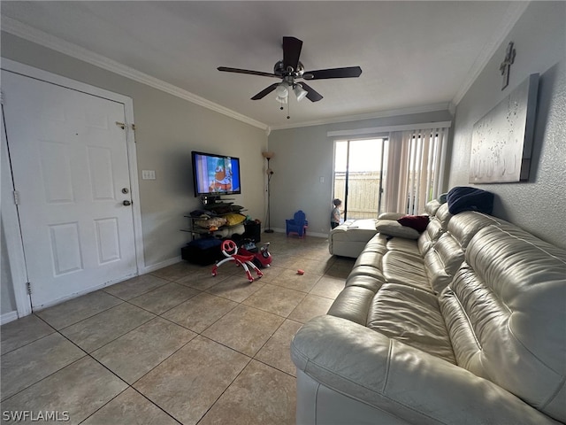 living room featuring ornamental molding, ceiling fan, and tile floors